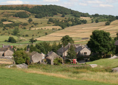 Picture of Little Hucklow with distant view of telephone box